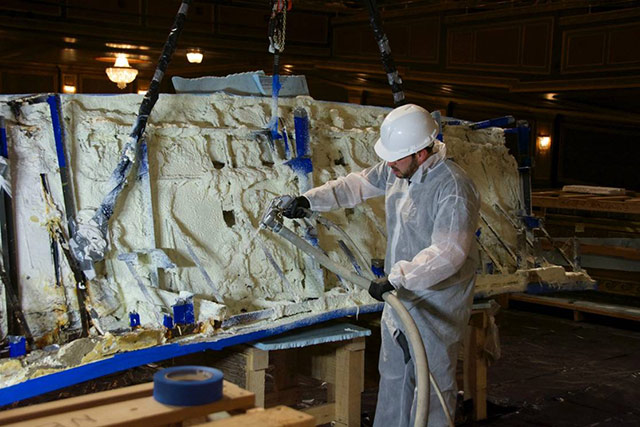 Technician applies HPCS RE Aramid Gel to reinforce cast plaster section of proscenium arch prior to reinstallation (Photo courtesy of Iconoplast Designs)