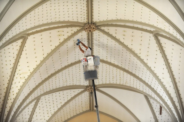 Holes being drilled in the plaster ceiling of St. Mary of the Mount in preparation for treatment with HPCS RE Aramid Gel