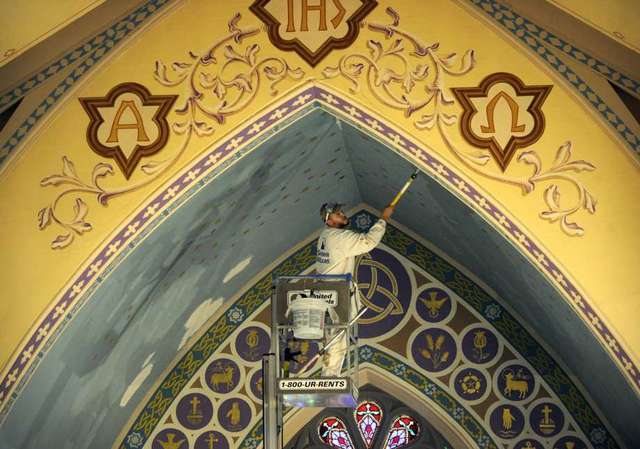 HPCS technician working to stabilize the plaster on wood lath painted ceiling inside Trinity Episcopal Church in Newtown, Connecticut