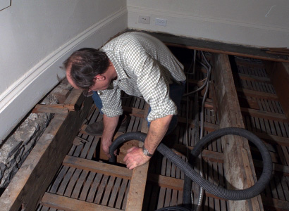 Cleaning the lath and plaster from the attic above the Royal Suite in Rideau Hall